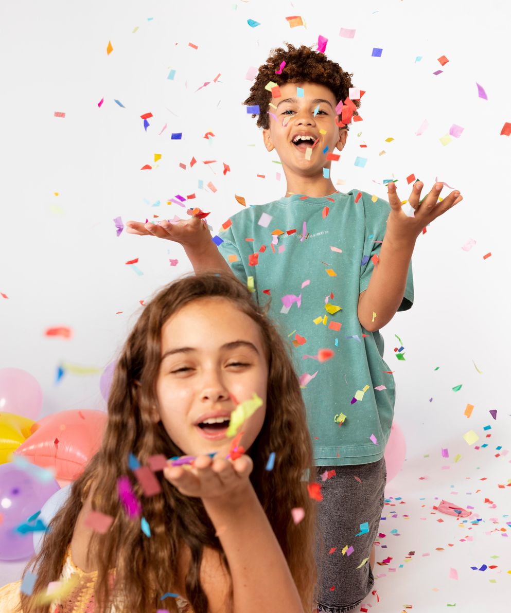 medium-shot-kids-having-fun-with-confetti